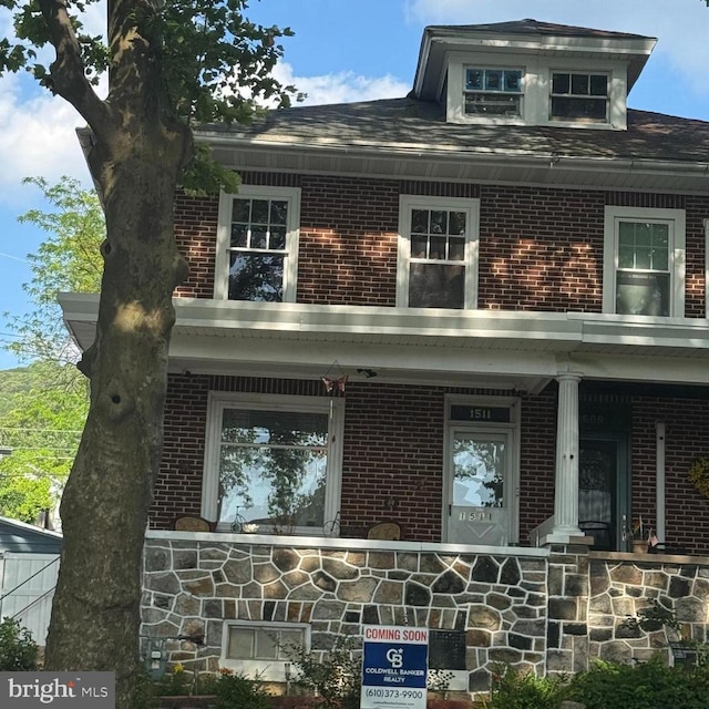1511 Palm St, Reading, PA 19604 - american foursquare style home with brick siding and covered porch