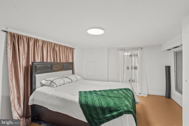 1511 Palm St, Reading, PA 19604 - bedroom featuring baseboards and finished concrete floors
