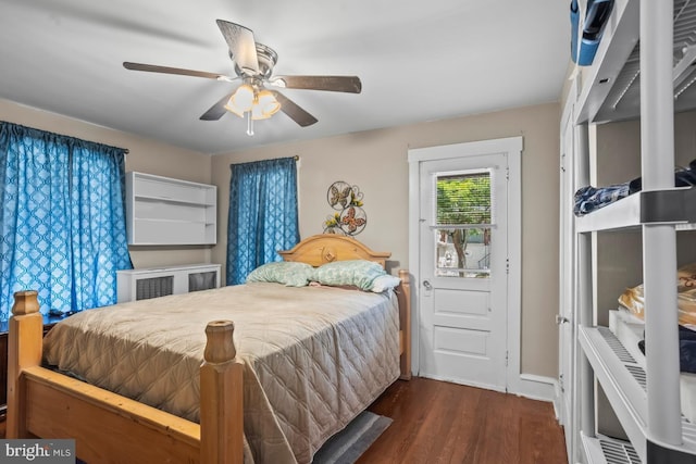 1511 Palm St, Reading, PA 19604 - bedroom with dark wood-style floors, radiator, and ceiling fan