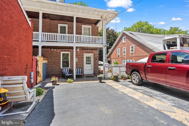 1511 Palm St, Reading, PA 19604 - view of front of property with brick siding and a balcony
