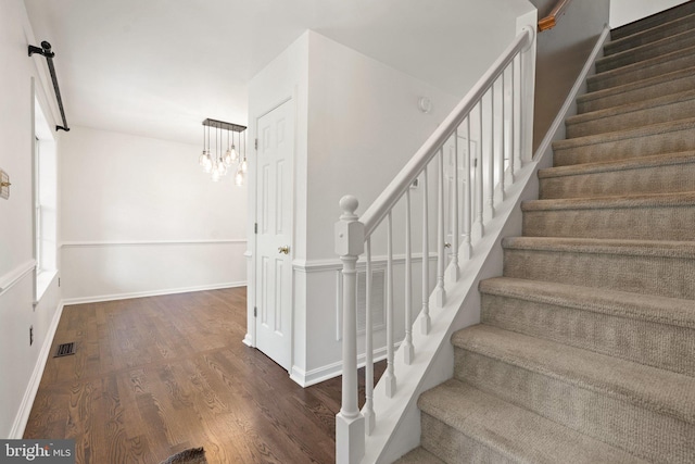 14057 Broadview Ln, Culpeper, VA 22701 - stairs with wood finished floors and a chandelier