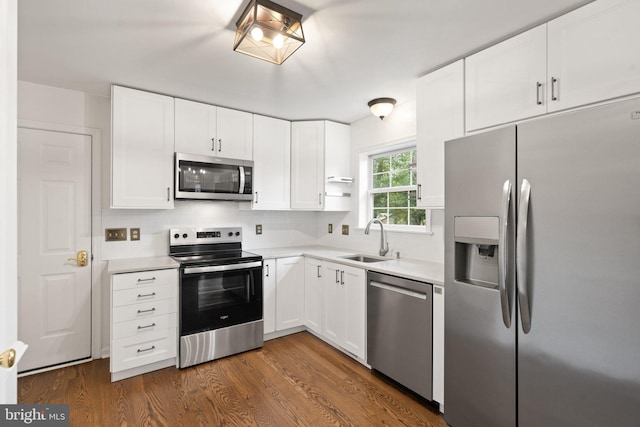 14057 Broadview Ln, Culpeper, VA 22701 - kitchen with appliances with stainless steel finishes, white cabinetry, dark wood-style floors, and light countertops