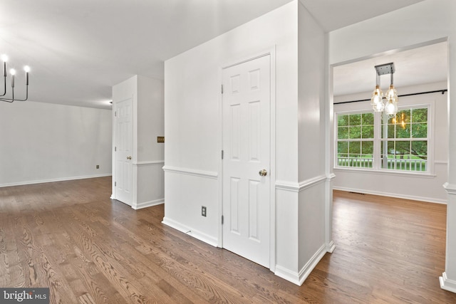 14057 Broadview Ln, Culpeper, VA 22701 - spare room featuring a chandelier and wood finished floors