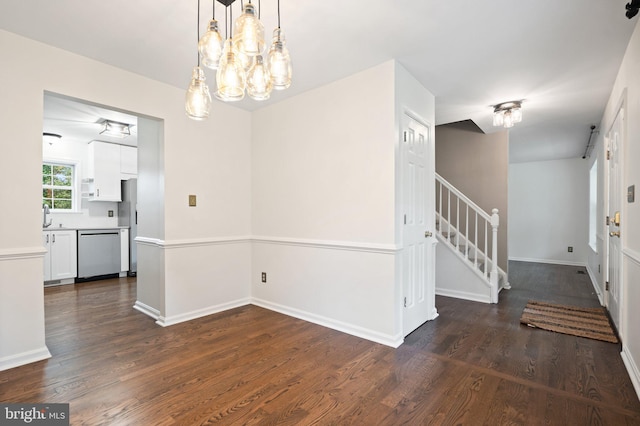 14057 Broadview Ln, Culpeper, VA 22701 - unfurnished dining area featuring dark wood finished floors, stairway, and a chandelier