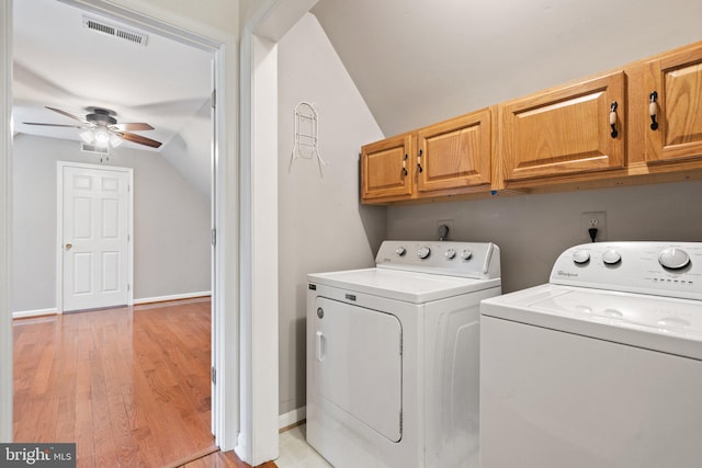 14057 Broadview Ln, Culpeper, VA 22701 - laundry area featuring washer and dryer, cabinet space, ceiling fan, and light wood-style floors