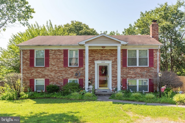 5955 Plumwood Ln, Woodbridge, VA 22193 - raised ranch with a front lawn, brick siding, and a chimney
