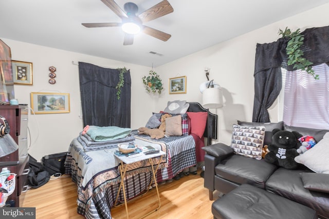 5955 Plumwood Ln, Woodbridge, VA 22193 - bedroom with wood finished floors and a ceiling fan