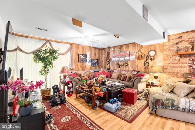 5955 Plumwood Ln, Woodbridge, VA 22193 - living area featuring wood finished floors, a ceiling fan, and wood walls