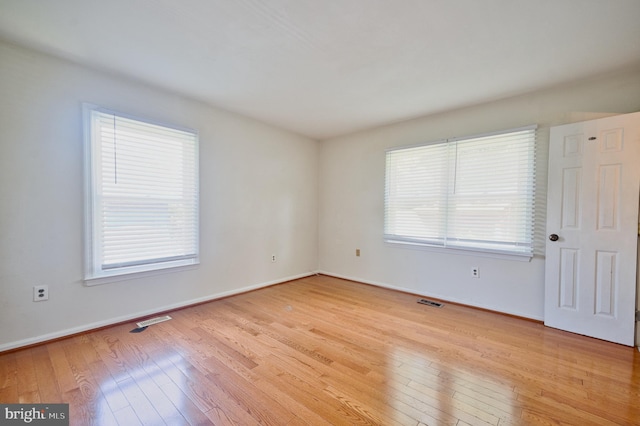 12805 Poplar St, Silver Spring, MD 20904 - spare room featuring light wood-style flooring and plenty of natural light
