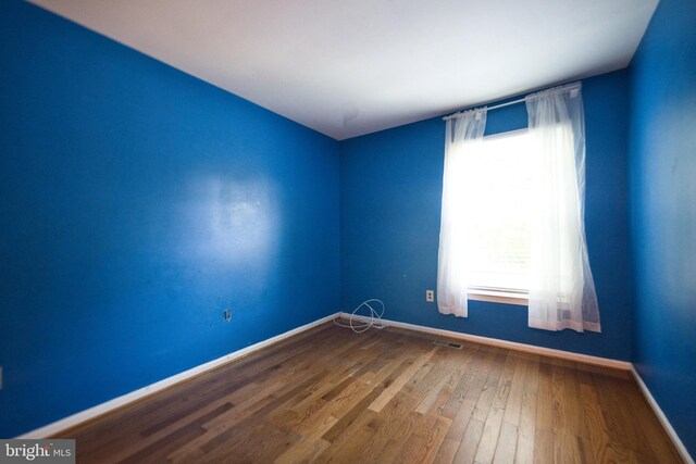 12805 Poplar St, Silver Spring, MD 20904 - spare room with plenty of natural light and wood finished floors