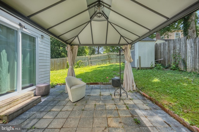 12805 Poplar St, Silver Spring, MD 20904 - fenced backyard featuring a patio area, a storage unit, and a gazebo