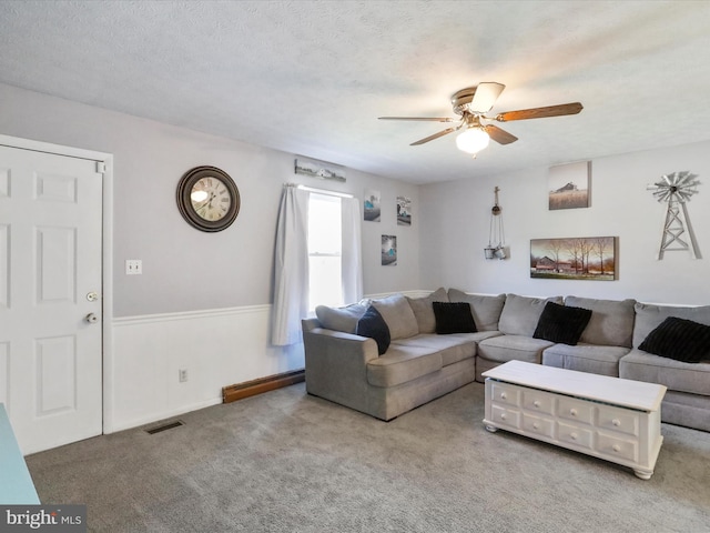 674 Harrison Ave, Berkeley Springs, WV 25411 - carpeted living room featuring ceiling fan