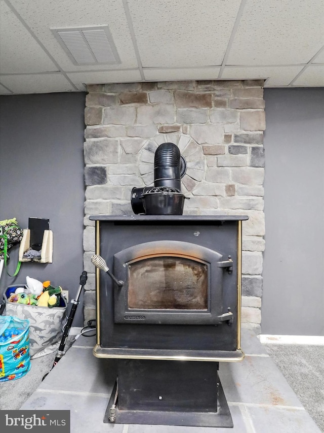 674 Harrison Ave, Berkeley Springs, WV 25411 - detailed view of a wood stove and a drop ceiling
