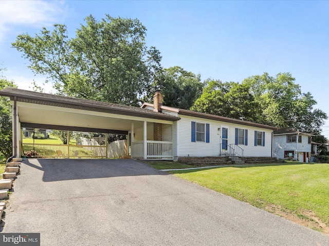 674 Harrison Ave, Berkeley Springs, WV 25411 - ranch-style home featuring driveway, a carport, and a chimney