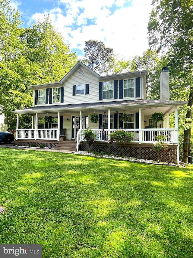 750 Ox Bow Ln, Lusby, MD 20657 - view of front of house with a porch, a chimney, and a front lawn