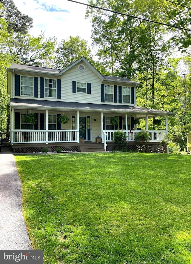 750 Ox Bow Ln, Lusby, MD 20657 - view of front of house featuring a porch and a front lawn