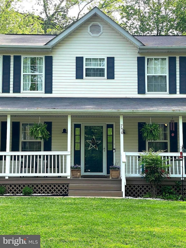 750 Ox Bow Ln, Lusby, MD 20657 - view of front facade featuring a porch and a front yard