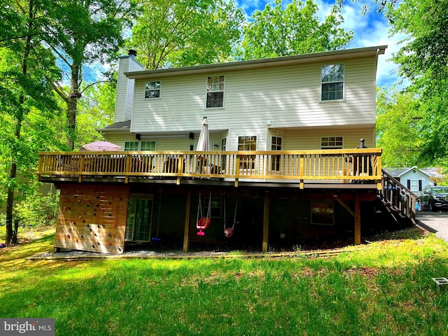 750 Ox Bow Ln, Lusby, MD 20657 - back of property with a chimney, a deck, and a lawn
