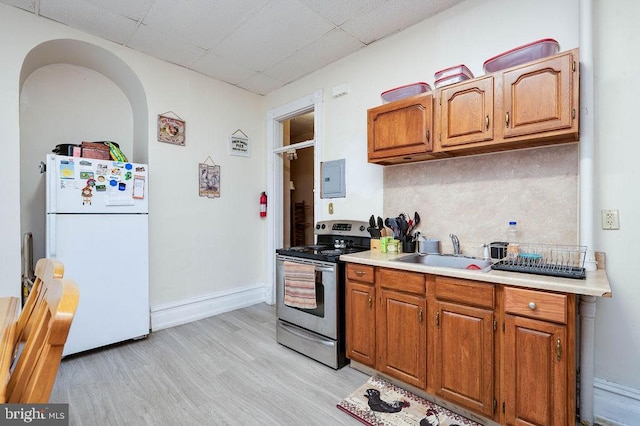 1407 Hill Rd, Reading, PA 19602 - kitchen with freestanding refrigerator, stainless steel range with electric cooktop, a drop ceiling, electric panel, and light countertops