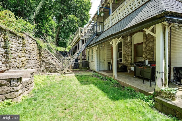 1407 Hill Rd, Reading, PA 19602 - view of green lawn with stairs, a patio, and a wooden deck