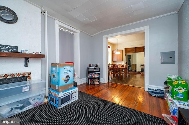 1407 Hill Rd, Reading, PA 19602 - rec room featuring electric panel, ornamental molding, and wood-type flooring