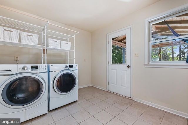 4119 Waterview Dr, Edgewater, MD 21037 - laundry area with washing machine and dryer and light tile patterned flooring