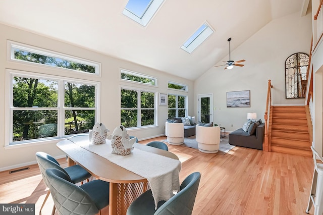 4119 Waterview Dr, Edgewater, MD 21037 - dining space featuring a skylight, healthy amount of natural light, light wood-type flooring, and high vaulted ceiling