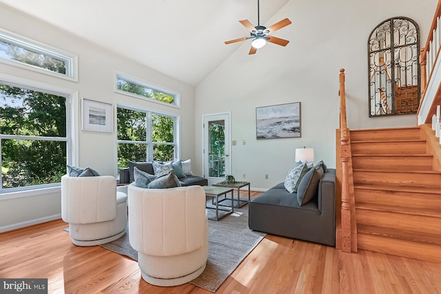 4119 Waterview Dr, Edgewater, MD 21037 - living room with high vaulted ceiling, light wood-style flooring, healthy amount of natural light, stairs, and ceiling fan