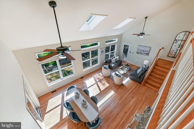 4119 Waterview Dr, Edgewater, MD 21037 - living room with ceiling fan, a skylight, high vaulted ceiling, and light wood-type flooring