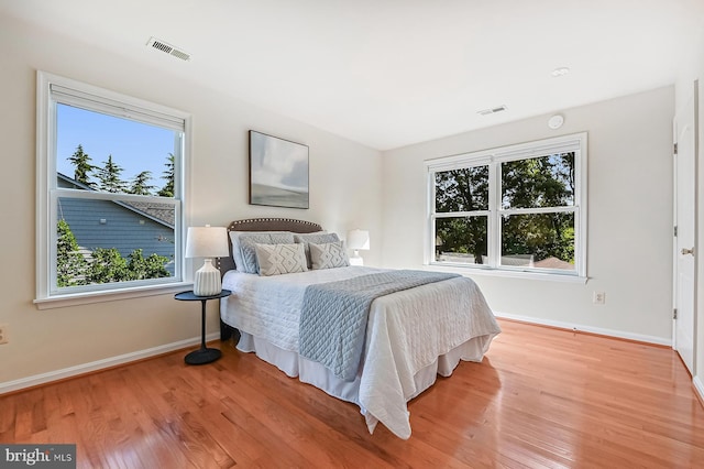 4119 Waterview Dr, Edgewater, MD 21037 - bedroom featuring multiple windows and wood finished floors