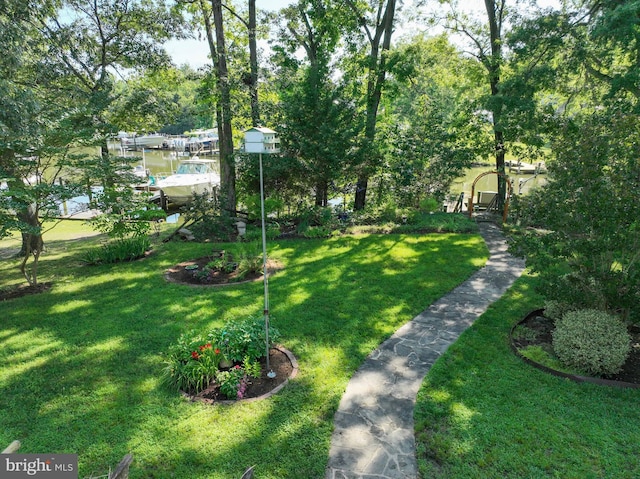4119 Waterview Dr, Edgewater, MD 21037 - view of grassy yard featuring a dock and view of scattered trees
