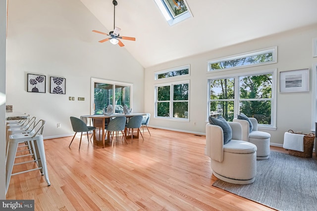 4119 Waterview Dr, Edgewater, MD 21037 - living room featuring high vaulted ceiling, ceiling fan, light wood-style flooring, and a skylight