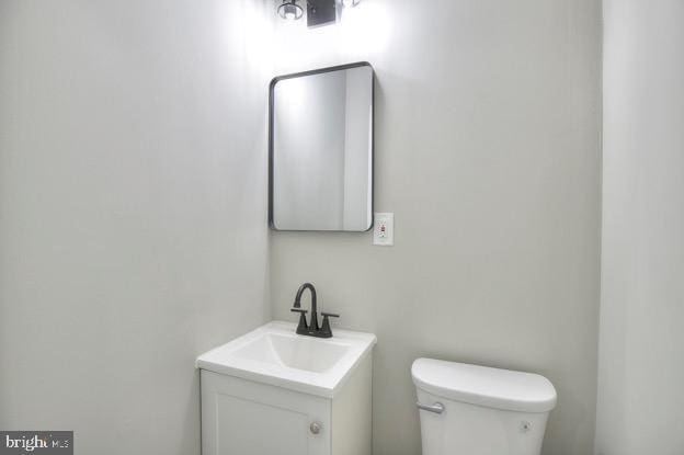 429 N Lakewood Ave, Baltimore, MD 21224 - half bathroom featuring vanity and toilet
