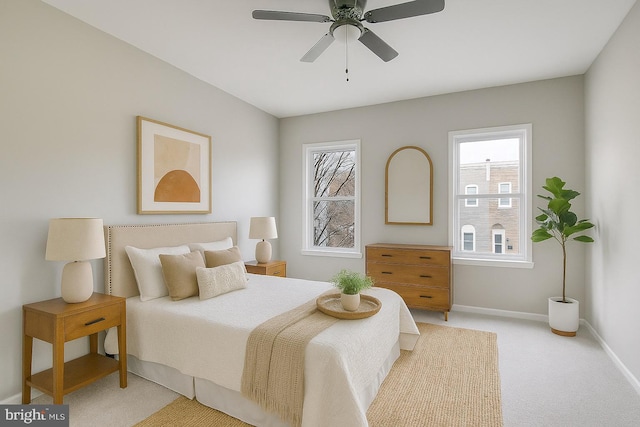 429 N Lakewood Ave, Baltimore, MD 21224 - bedroom with light colored carpet, multiple windows, and a ceiling fan