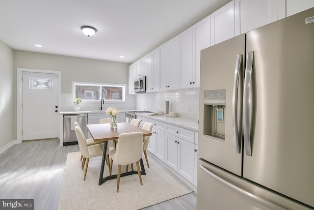 429 N Lakewood Ave, Baltimore, MD 21224 - dining area featuring light wood-style floors and recessed lighting