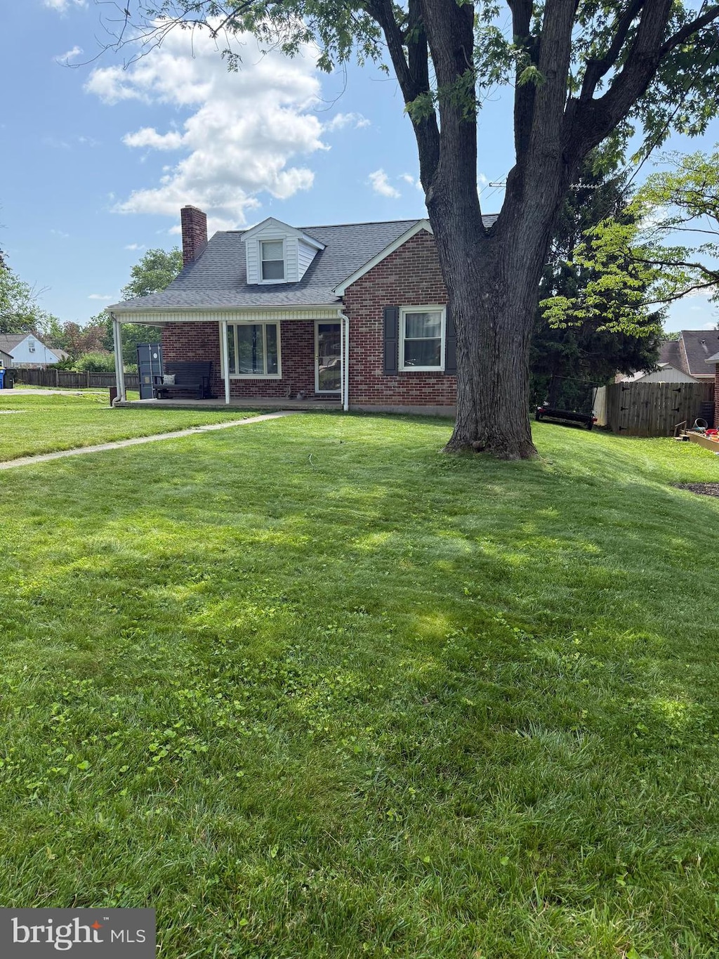 404 Corbin Rd, York, PA 17403 - view of front of property with brick siding and a chimney