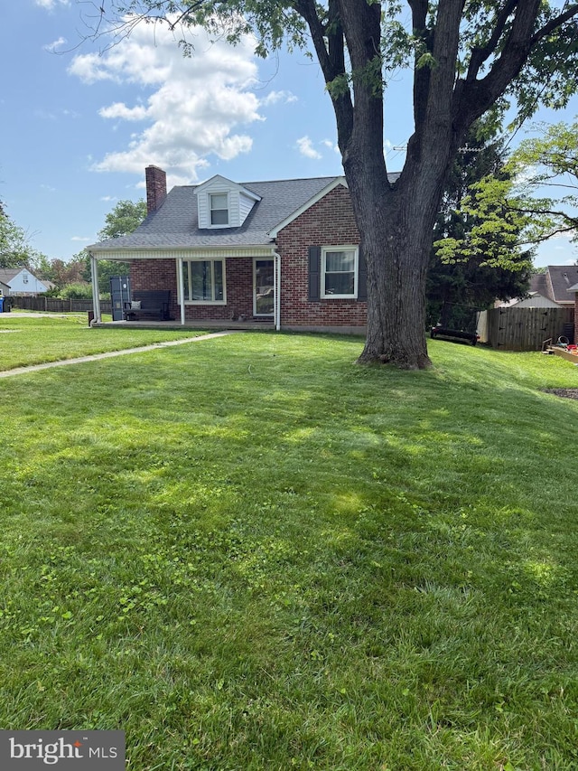 404 Corbin Rd, York, PA 17403 - view of front of property with brick siding and a chimney