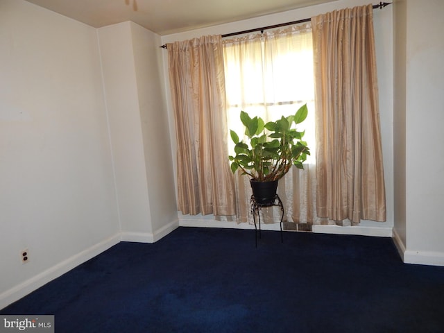 5809 Eurith Ave, Baltimore, MD 21206 - spare room featuring baseboards and dark colored carpet