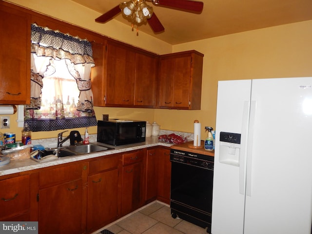 5809 Eurith Ave, Baltimore, MD 21206 - kitchen with black appliances, light countertops, ceiling fan, light tile patterned flooring, and brown cabinets