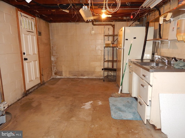 5809 Eurith Ave, Baltimore, MD 21206 - unfinished below grade area featuring a sink and freestanding refrigerator