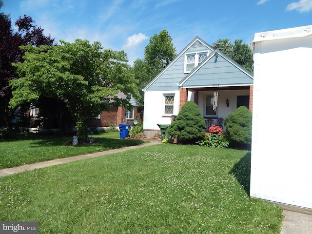 5809 Eurith Ave, Baltimore, MD 21206 - bungalow featuring a front lawn and brick siding