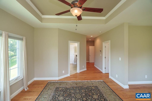 3525 Rocks Mill Ln, Charlottesville, VA 22903 - spare room featuring light wood-style floors, a raised ceiling, a ceiling fan, and crown molding