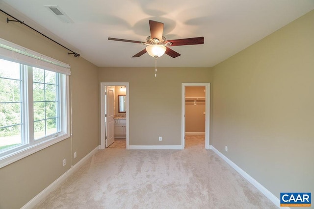 3525 Rocks Mill Ln, Charlottesville, VA 22903 - unfurnished bedroom with multiple windows, light carpet, a walk in closet, and a closet