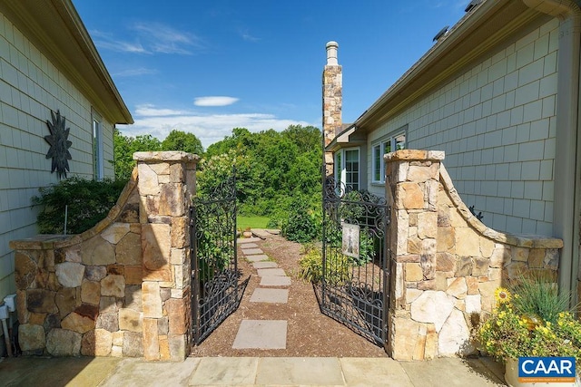 3525 Rocks Mill Ln, Charlottesville, VA 22903 - view of side of home featuring a gate and stone siding