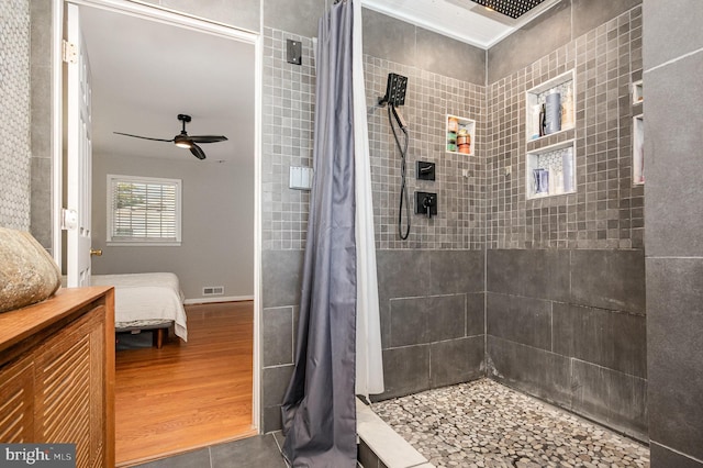 9016 Greylock St, Alexandria, VA 22308 - ensuite bathroom featuring a tile shower and ceiling fan