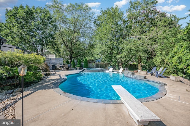 9016 Greylock St, Alexandria, VA 22308 - view of pool with a patio area, a fenced backyard, a diving board, and a pool with connected hot tub