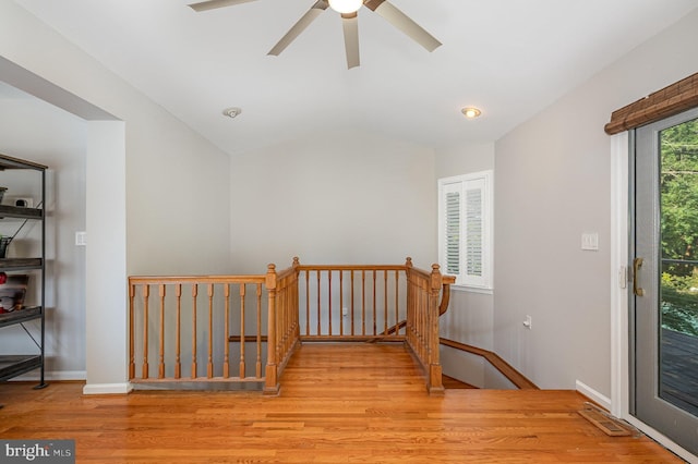 9016 Greylock St, Alexandria, VA 22308 - hall featuring wood finished floors, vaulted ceiling, and an upstairs landing