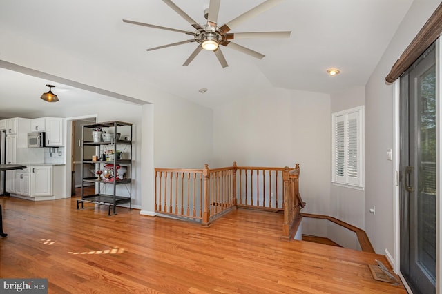 9016 Greylock St, Alexandria, VA 22308 - interior space featuring vaulted ceiling, light wood finished floors, and a ceiling fan