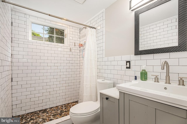 9016 Greylock St, Alexandria, VA 22308 - full bath with vanity, a tile shower, and tile walls