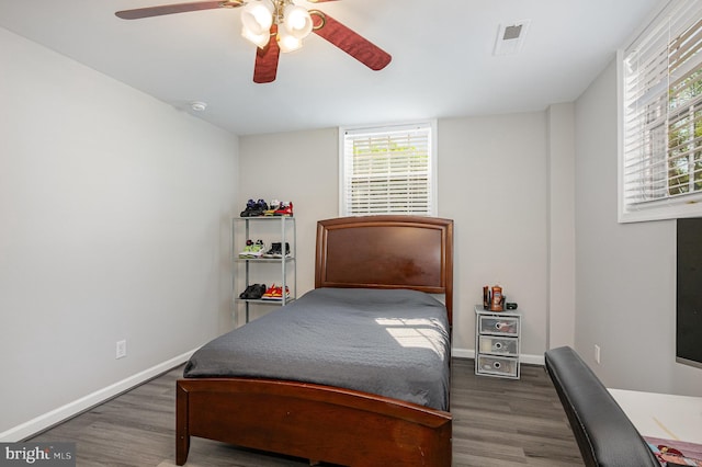 9016 Greylock St, Alexandria, VA 22308 - bedroom featuring wood finished floors, multiple windows, and a ceiling fan